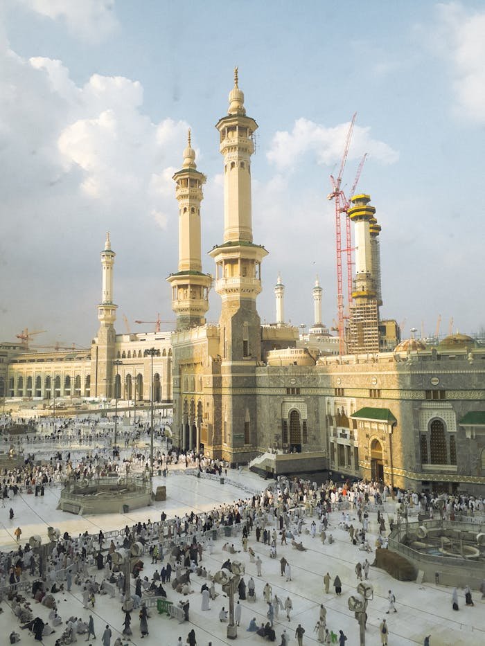 Pilgrims gather at the iconic Great Mosque in Mecca, Saudi Arabia, a key Islamic site.